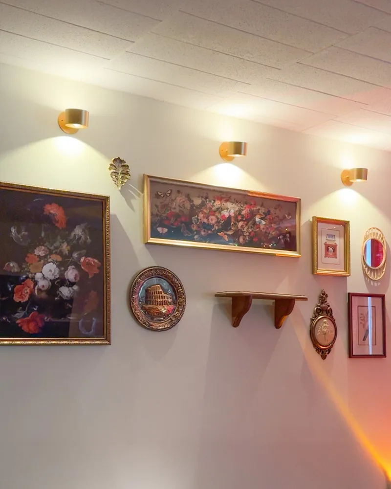 Warm Halo Lux lighting across an art wall